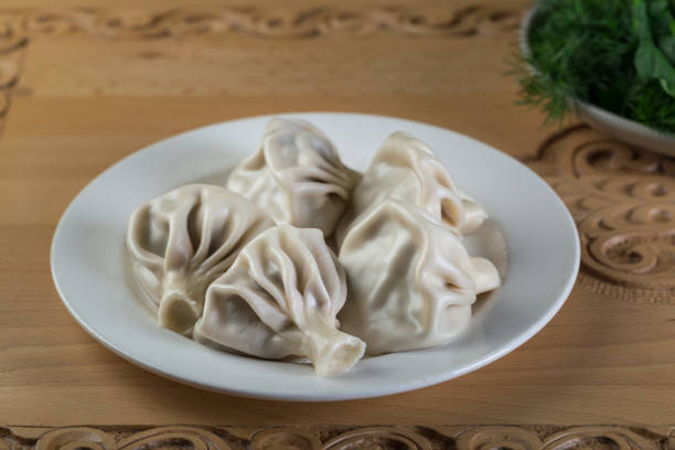 istock Georgian dumplings Khinkali with meat. Khinkali in a white plate 1281906462