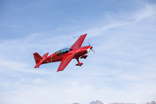 Bishop California, USA, March 14, 2015.  Bishop Airport, (KBIH). \nFAA Registry identifies this aircraft as a EXTRA FLUGZEUBAU EA-300 Experimental, Exhibition.  It is a two place aerobatic capable, fixed landing gear aircraft, with a fuel injected Lycoming AEIO-540 SER 300 Horsepower engine.  Cruise speed 197 MPH, top speed of 250 + MPH\nPilot landed at Bishop Airport for fuel and lunch and provided in impromptu photo-op.