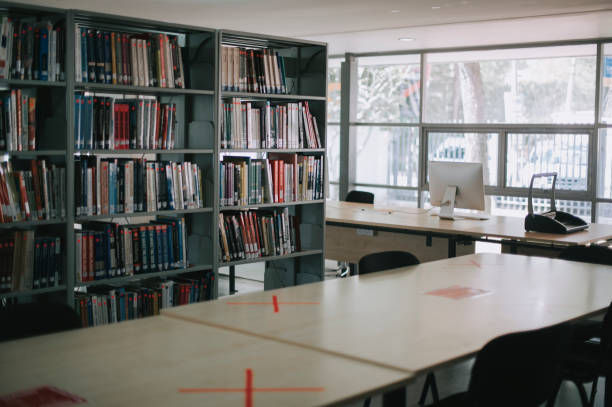 istock empty college library with cross sign social distancing 1281913404