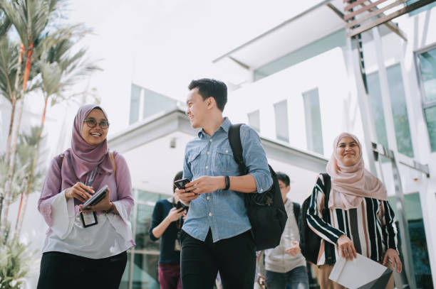 istock group of asian university student walking out from education building talking 1281913472