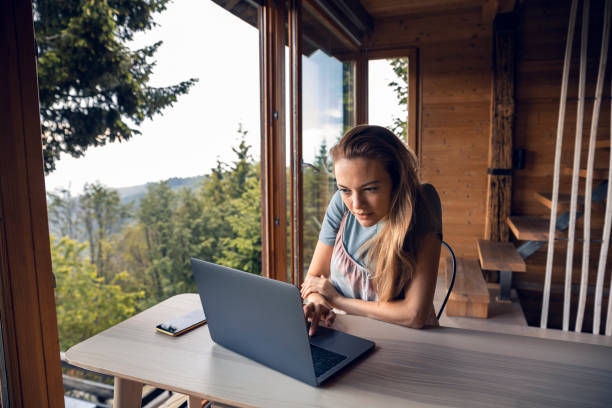 istock Young woman working from home 1281914195