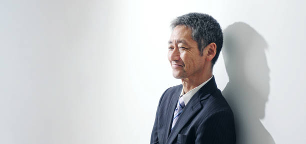 istock Smiling middle aged asian businessman. 1281914200