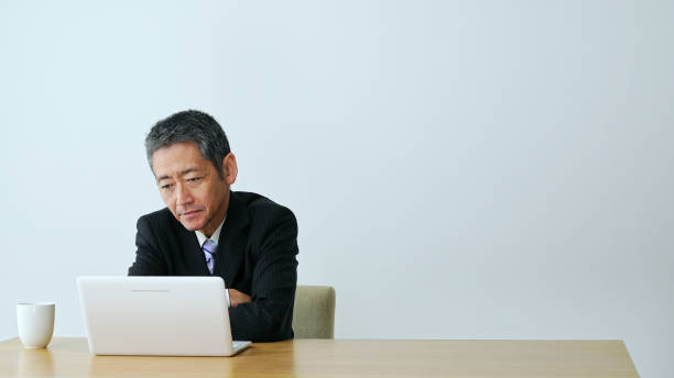 istock Thoughtful middle aged businessman in office. 1281914209