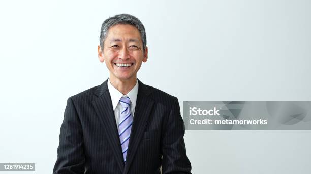 Smiling Middle Aged Asian Businessman Stock Photo - Download Image Now - Japanese Ethnicity, Businessman, Men