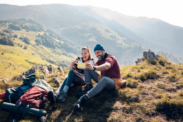 istock Young couple taking a selfie while out camping 1281915129