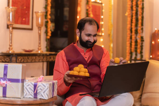 istock Young man in tradional wear working on laptop in different expressions 1281915159