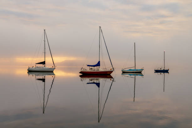 istock Misty Morning with Boats and Reflections on the Bay 1281916018
