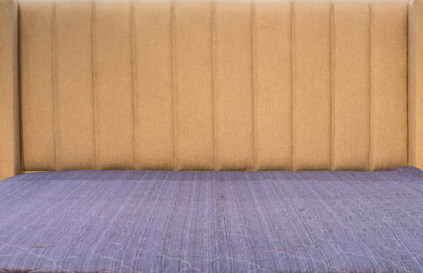 istock Modern bedroom interior close up. The made bed is ready for bed. 1281917784