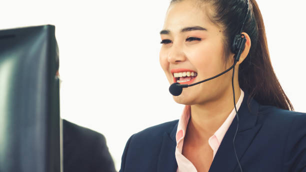 istock Business people wearing headset working in office 1281921572