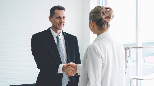 istock Business people handshake in corporate office 1281923898