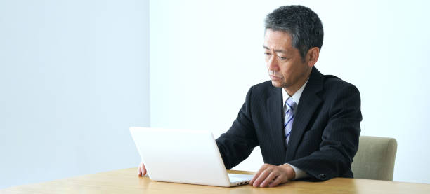 istock Thoughtful middle aged businessman in office. 1281924075