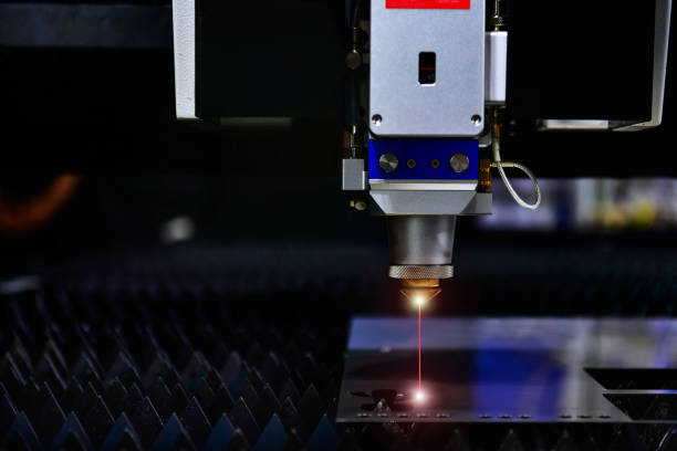 Industrial laser cut machine while cutting the sheet metal with the sparking light