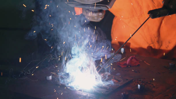 istock Metal welder working with arc welding machine 1281924865