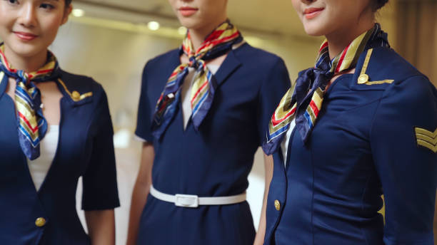 istock Group of cabin crew or air hostess in airplane 1281925674