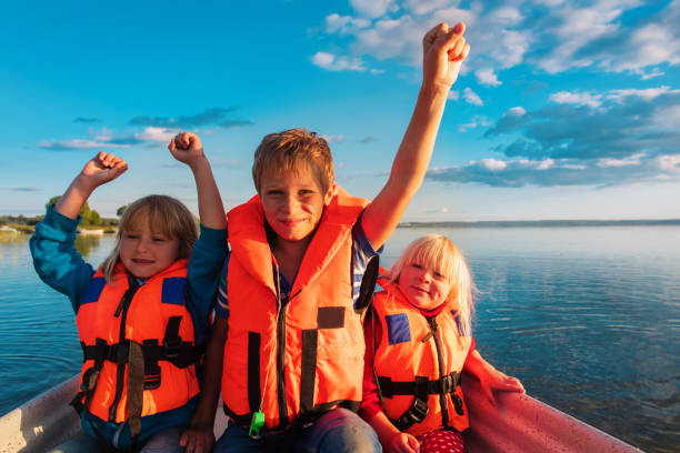 istock happy kids in boat ride on lake 1281926663