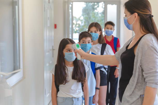 istock Temperature screening and medical check at school. 1281926859