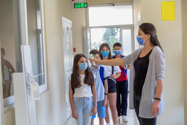 istock Temperature screening and medical check at school. 1281926953