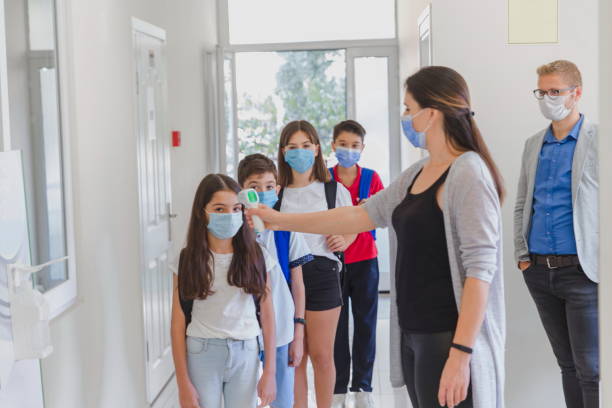 istock Temperature screening and medical check at school. 1281927268