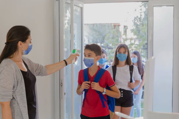 istock Temperature screening and medical check at school. 1281927274