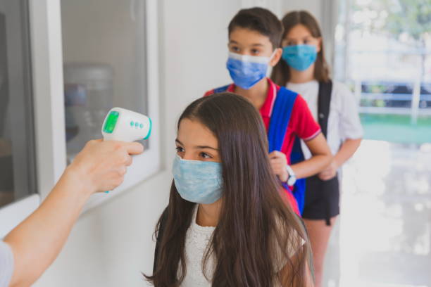 istock Temperature screening and medical check at school 1281927300