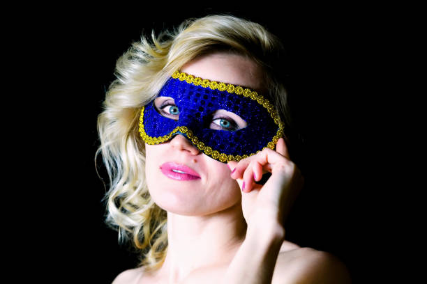 istock Woman in blue eye mask with bare shoulders 1281931038