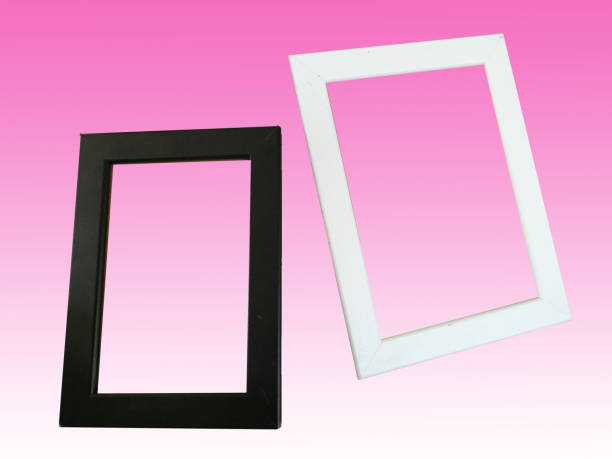 istock Black and white picture frame isolated on pink background 1281932110