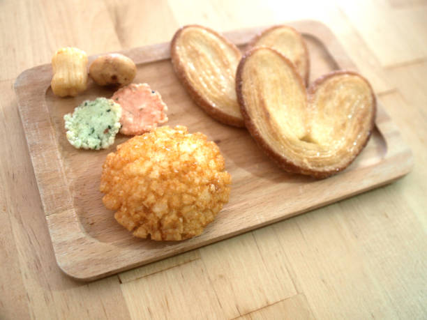 OLYMPUS DIGITAL CAMERA Japanese rice crackers palmier butterfly Crisp biscuits on table with wooden plate Afternoon tea tea time break time snack leisure table wooden plate
