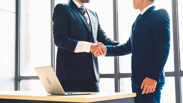 istock Business people handshake in corporate office 1281935851