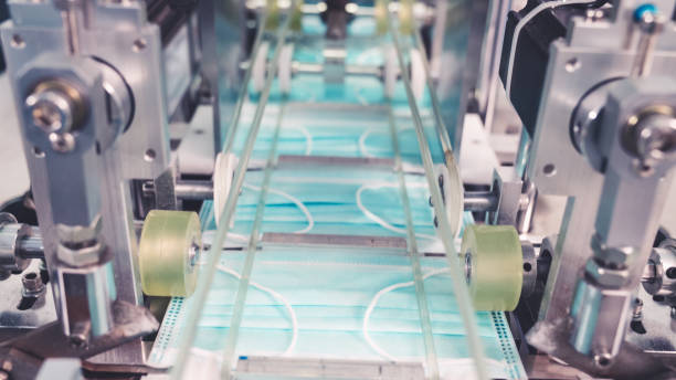istock Face mask production line in modern factory 1281936546