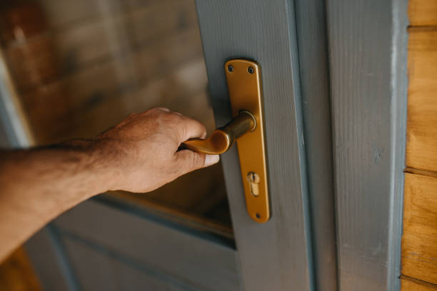 istock Close-Up Of Hand Holding Door 1281937654