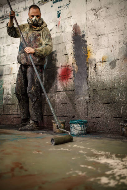 istock Artist paints the room 1281937898