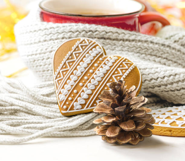 istock Christmas cookies and red mug wrapped in blue scarf 1281938562