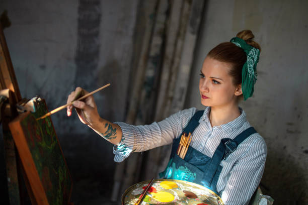 Young Caucasian woman at home art studio
