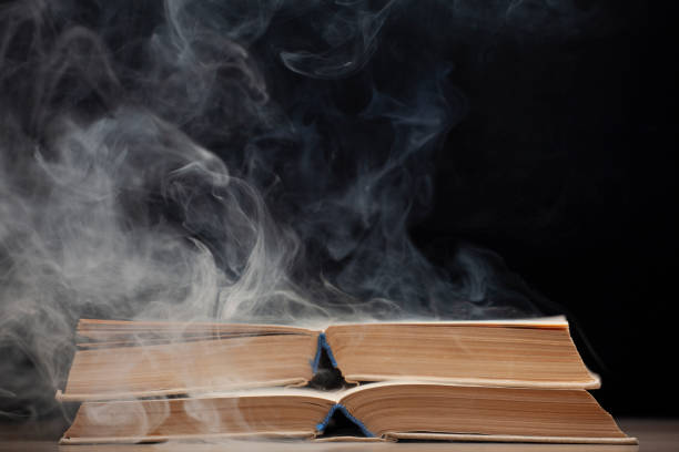 istock image of book smoke dark background 1281940212