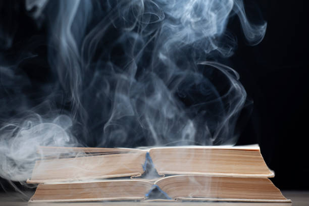 istock image of book smoke dark background 1281940215