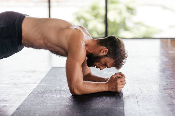 istock Yoga men workout in studio in front of a window 1281947355