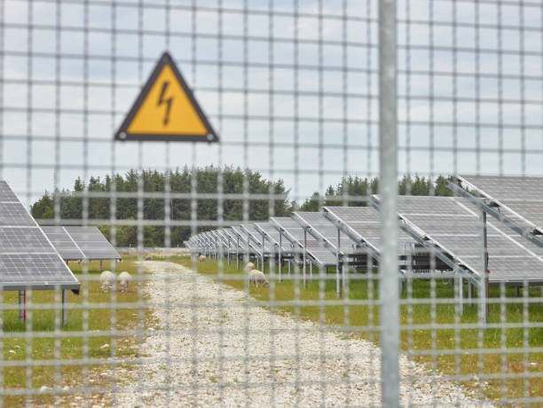 Electric fence in front of Solar Plant stock photo
