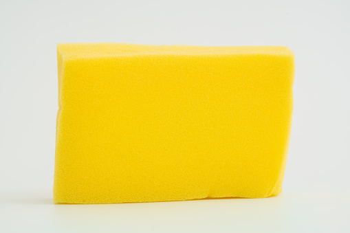 Yellow sponge isolated on the white background with clipping path