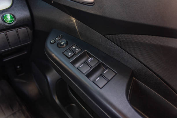 istock Car arm rest with Control Panel. Door Lock & Mirror Control. window adjustment buttons, door lock. Photography of a modern car. 1281951704