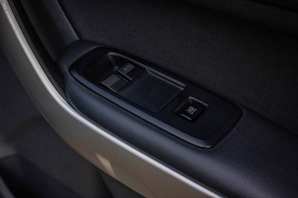 istock Car arm rest with Control Panel. Door Lock & Mirror Control. window adjustment buttons, door lock. Photography of a modern car. 1281951706