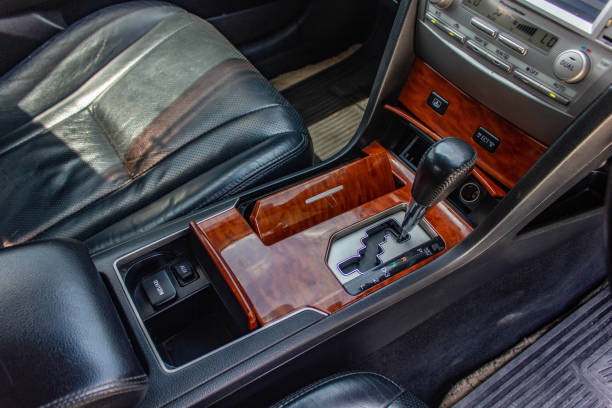 istock automatic transmission shift selector in the car interior. Closeup a manual shift of modern car gear shifter. 1281951712