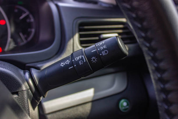 istock Switch off lights in a car. close-up Car integrated turning indicator with headlight switch toggle. 1281951714