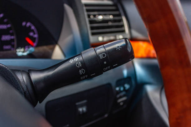istock Switch off lights in a car. close-up Car integrated turning indicator with headlight switch toggle. 1281951715