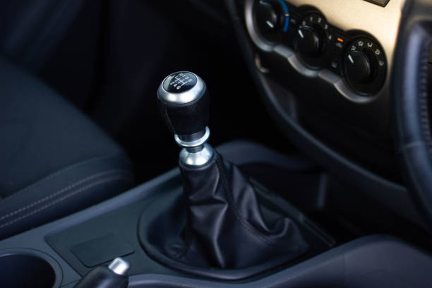 automatic transmission shift selector in the car interior. Closeup a manual shift of modern car gear shifter. automatic transmission shift selector in the car interior. Closeup a manual shift of modern car gear shifter. door lever stock pictures, royalty-free photos & images