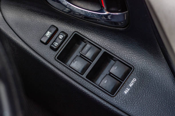istock Car arm rest with Control Panel. Door Lock & Mirror Control. window adjustment buttons, door lock. Photography of a modern car. 1281951721