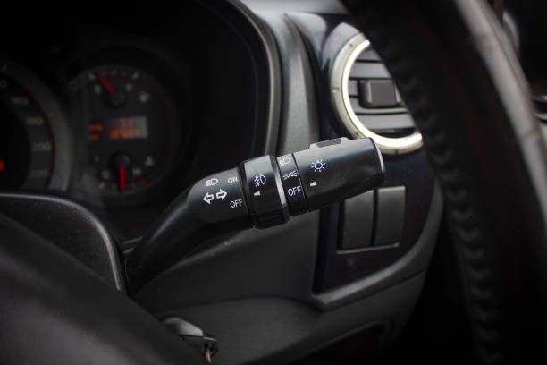 istock Switch off lights in a car. close-up Car integrated turning indicator with headlight switch toggle. 1281951751