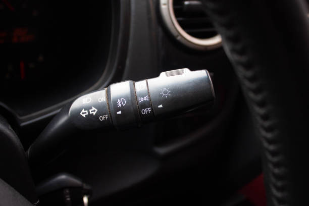 istock Switch off lights in a car. close-up Car integrated turning indicator with headlight switch toggle. 1281951769