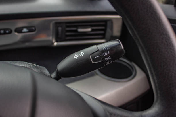 istock Switch off lights in a car. close-up Car integrated turning indicator with headlight switch toggle. 1281951780