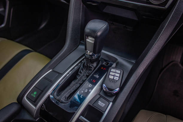 istock automatic transmission shift selector in the car interior. Closeup a manual shift of modern car gear shifter. 1281951783
