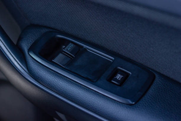 istock Car arm rest with Control Panel. Door Lock & Mirror Control. window adjustment buttons, door lock. Photography of a modern car. 1281951799